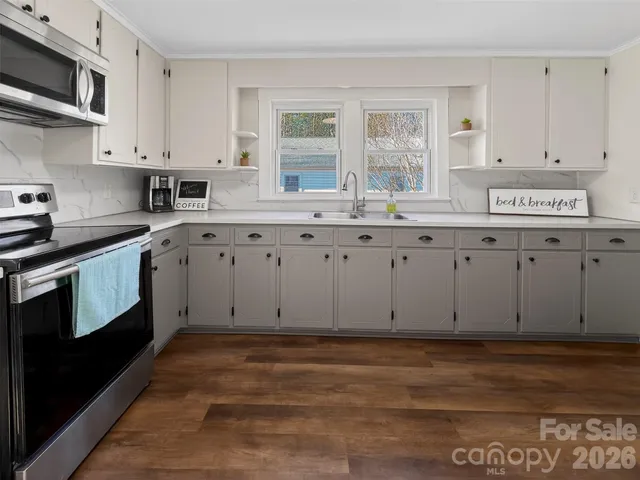 a view of cabinets with wooden floor