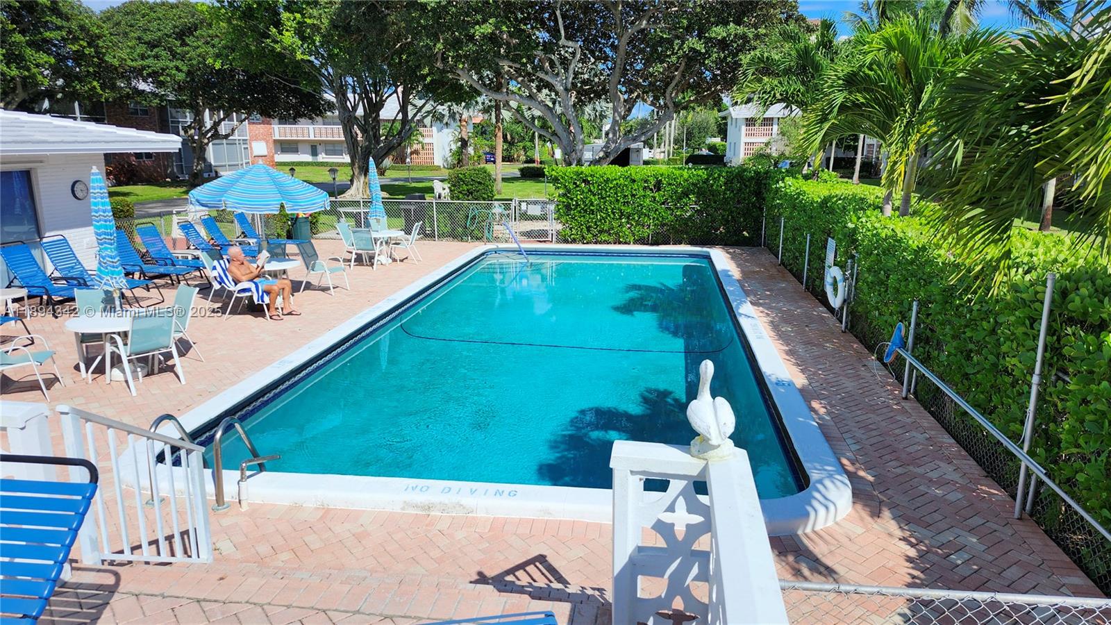 20 Southeast 13th Street, Unit C4 Boca Raton, FL 33432 - Photo 21 of 35 a view of yard from deck with patio