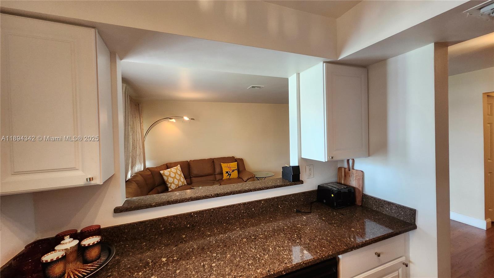 20 Southeast 13th Street, Unit C4 Boca Raton, FL 33432 - Photo 4 of 35 a living room with furniture and a wooden floor