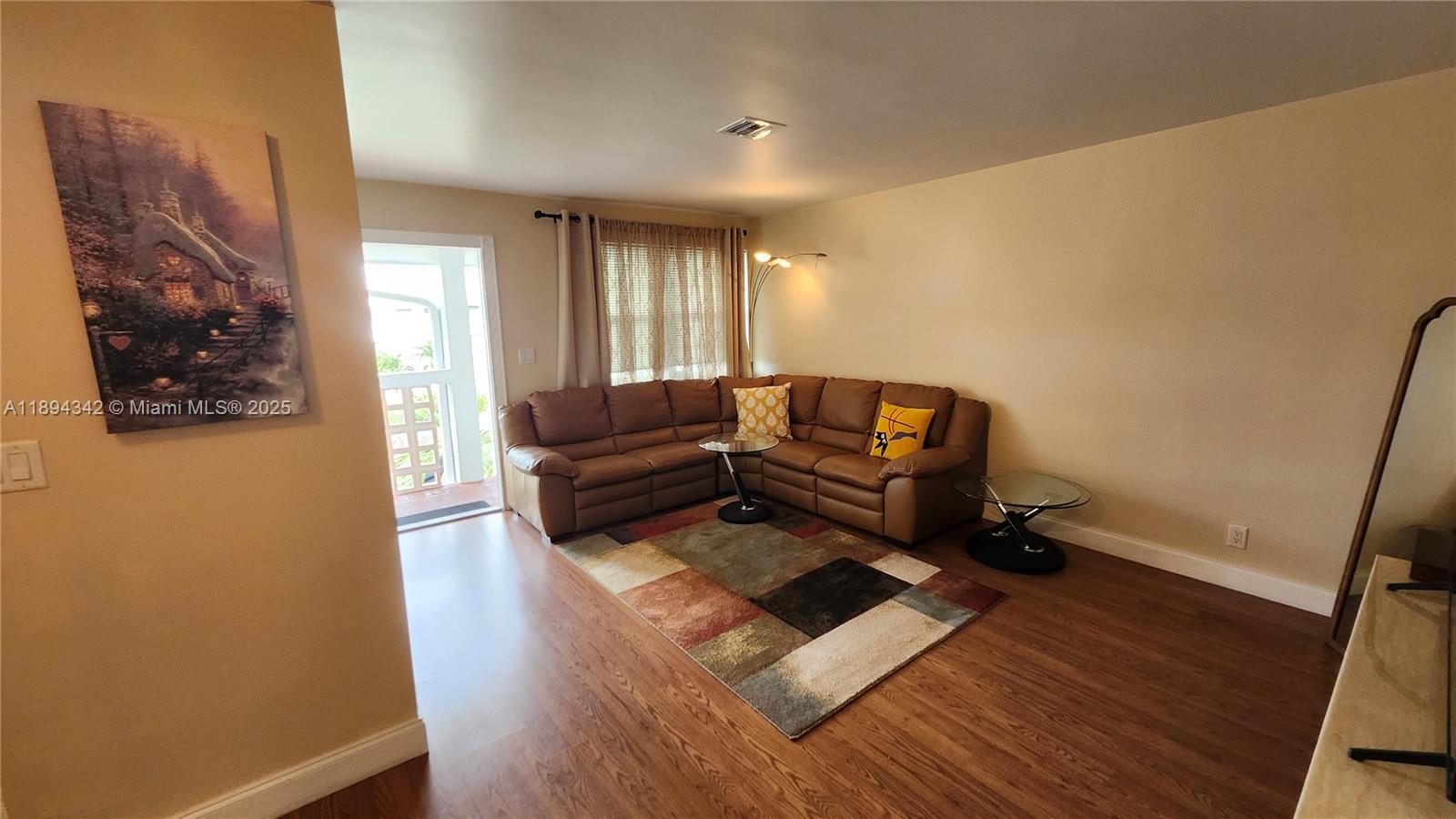 20 Southeast 13th Street, Unit C4 Boca Raton, FL 33432 - Photo 7 of 35 a living room with furniture and a rug