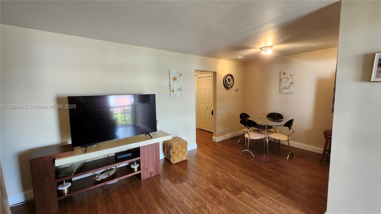 20 Southeast 13th Street, Unit C4 Boca Raton, FL 33432 - Photo 8 of 35 a living room with furniture and a flat screen tv