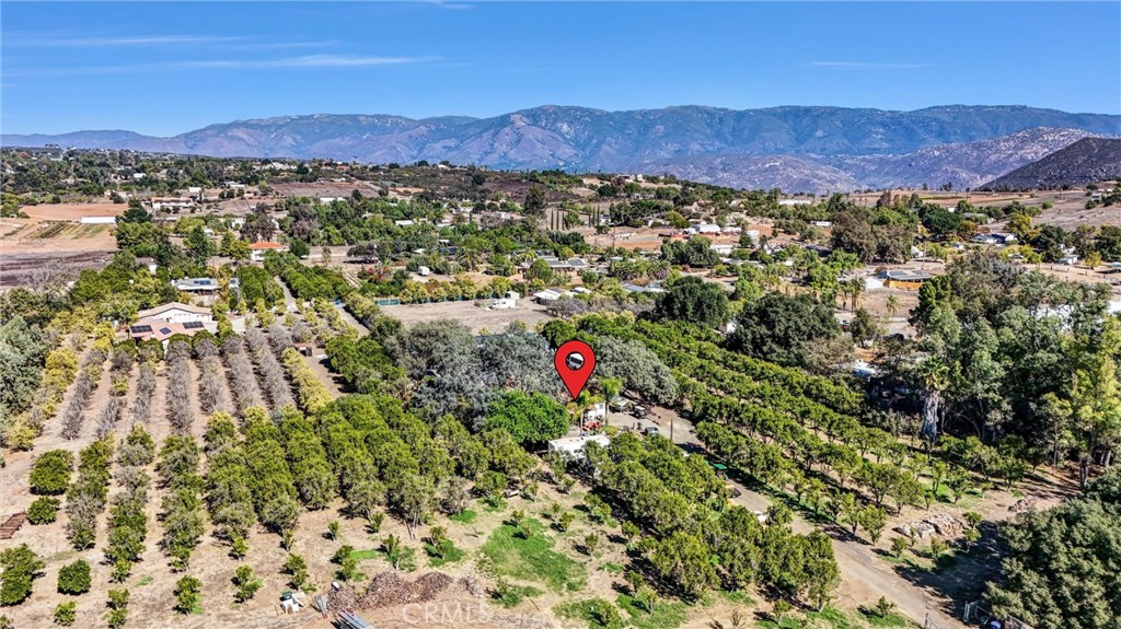 31030 Valley Center Road Valley Center, CA 92082 - Photo 18 of 20 a view of a lush green hillside and houses