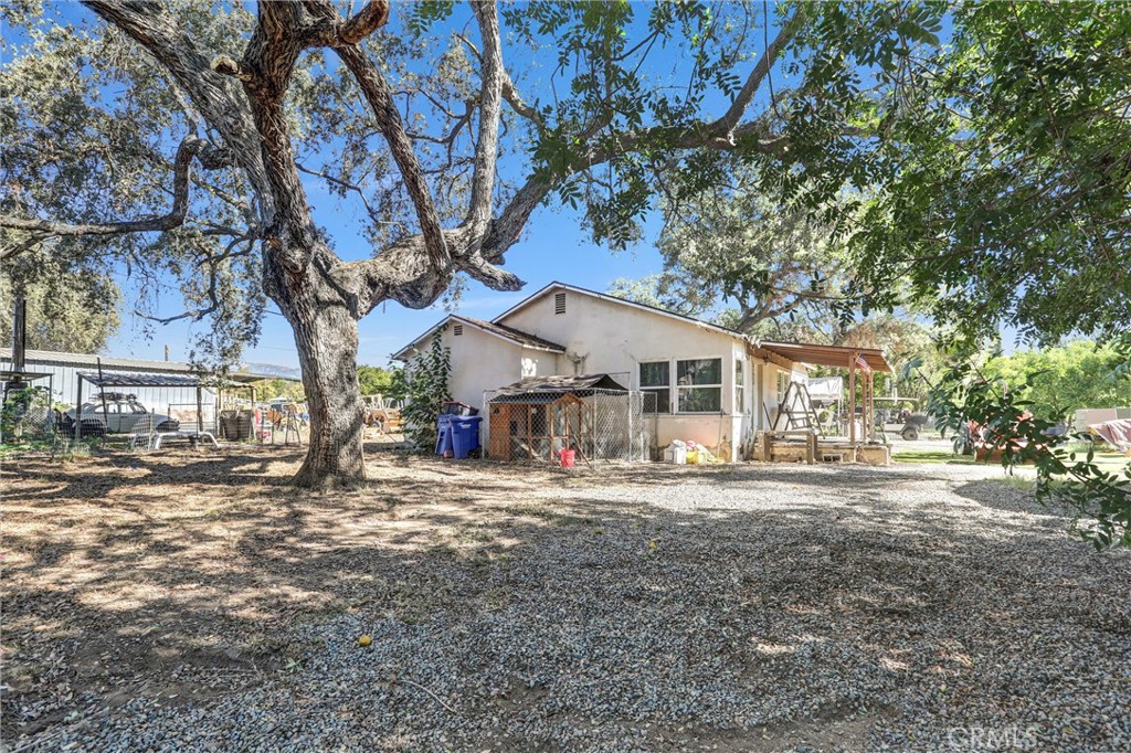31030 Valley Center Road Valley Center, CA 92082 - Photo 6 of 20 a view of a yard with a tree in the background