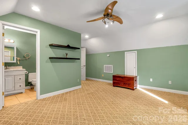 a living room with furniture cabinets and a rug