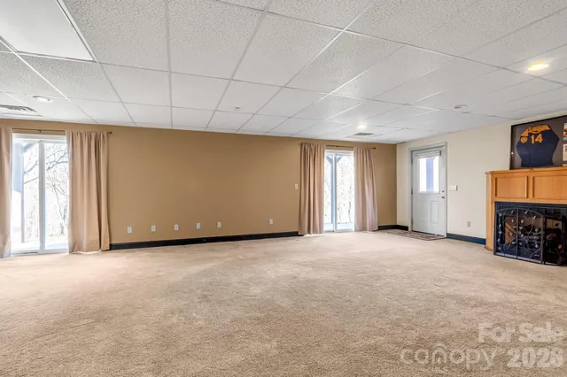 a bathroom with a sink a toilet and shower curtain