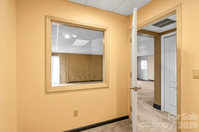 a bathroom with a tub sink and shower
