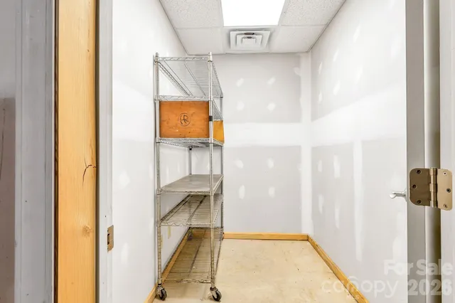 a view of a wooden deck with chairs