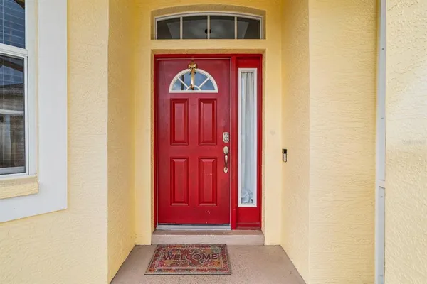 a view of front door with a red door