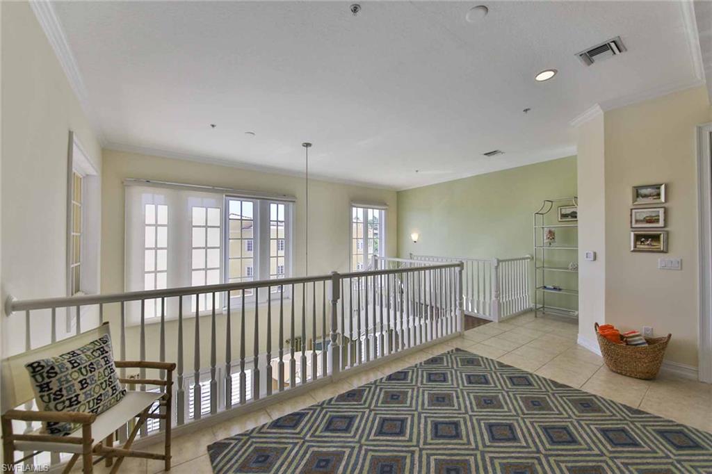 600 5th Avenue South, Unit A212 Naples, FL 34102 - Photo 11 of 21 a view of a hallway with a livingroom