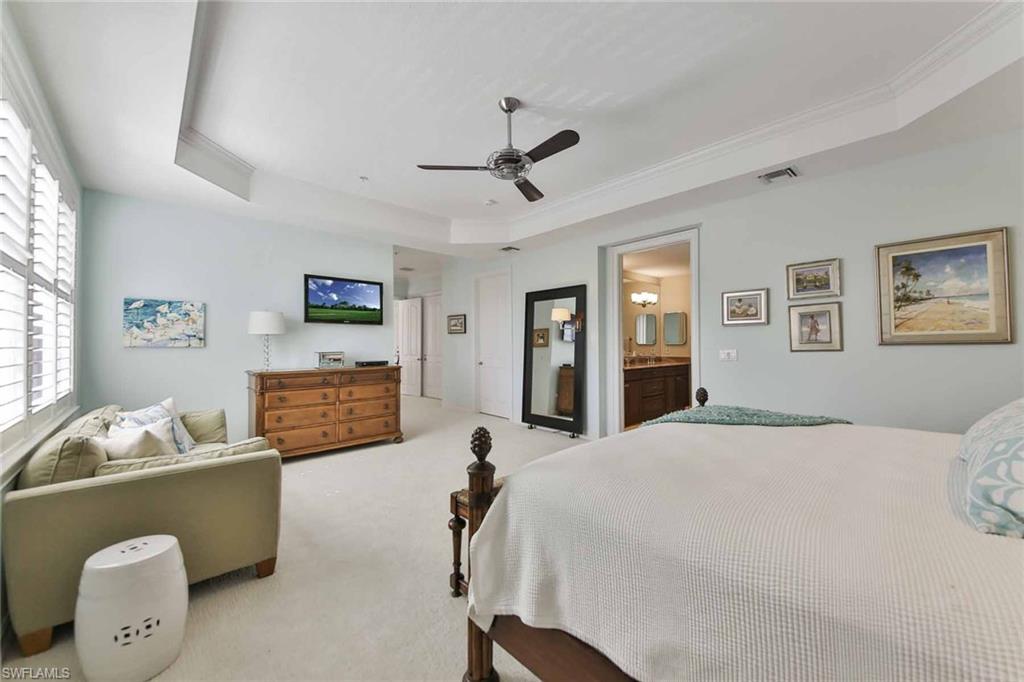 600 5th Avenue South, Unit A212 Naples, FL 34102 - Photo 13 of 21 a bedroom with a bed furniture and window