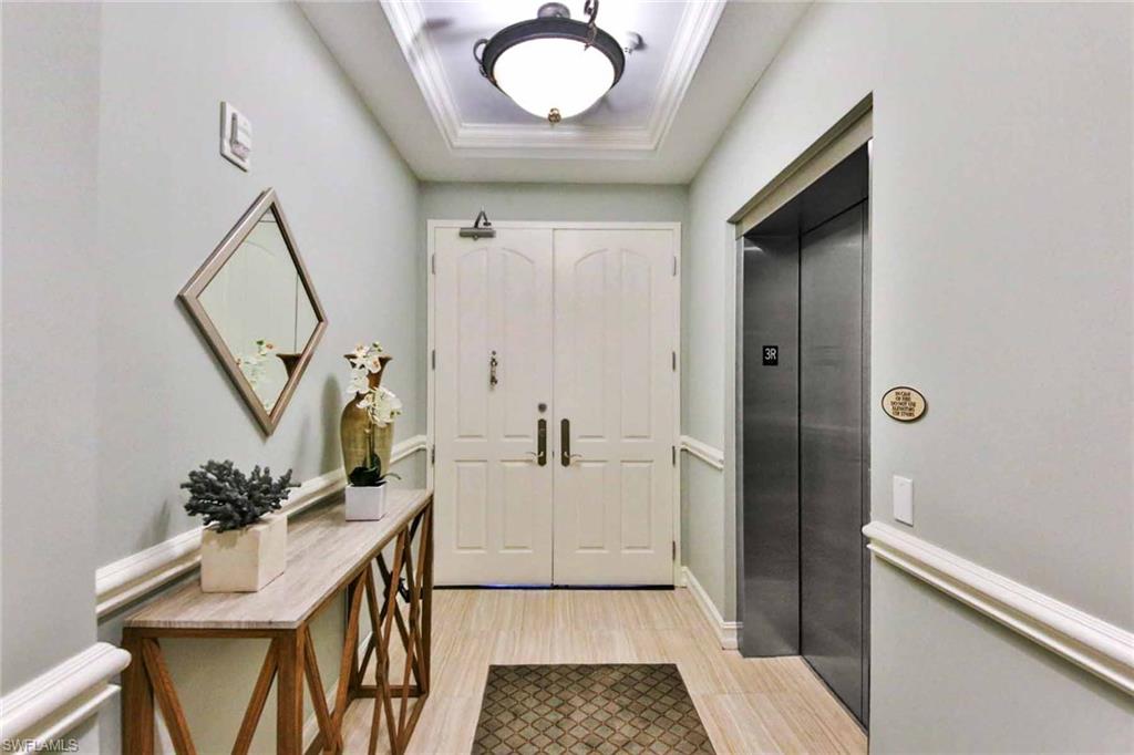 600 5th Avenue South, Unit A212 Naples, FL 34102 - Photo 7 of 21 a bathroom with a sink a mirror and a shower