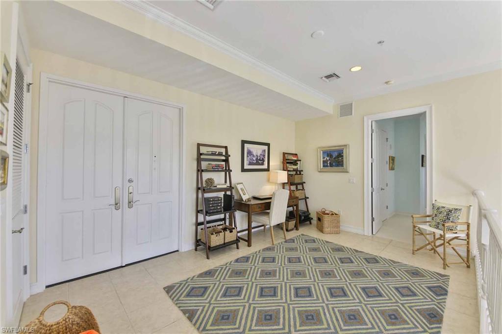 600 5th Avenue South, Unit A212 Naples, FL 34102 - Photo 10 of 21 a view of a livingroom with furniture and a window