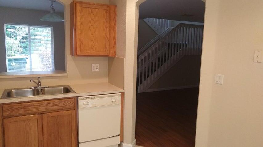 8052 Big Pine Way Riviera Beach, FL 33407 - Photo 5 of 10 a kitchen with a sink and a window