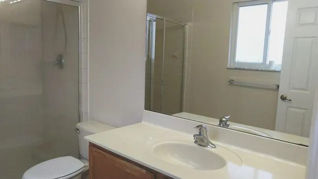 a bathroom with a sink toilet and vanity