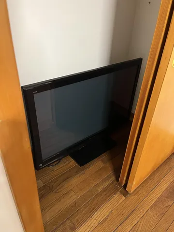 a bathroom with a shower and a toilet