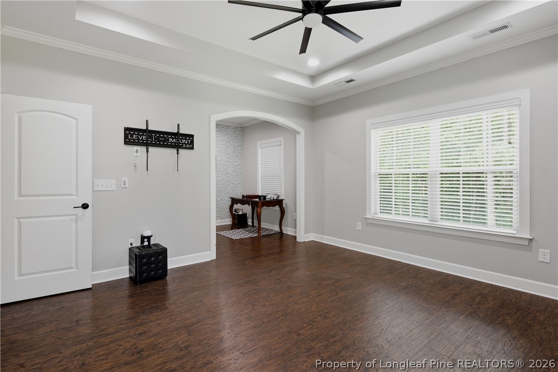 148 Heatherspring Way Spring Lake, NC 28390 - Photo 27 of 50 a view of a livingroom with a hardwood floor and a ceiling fan