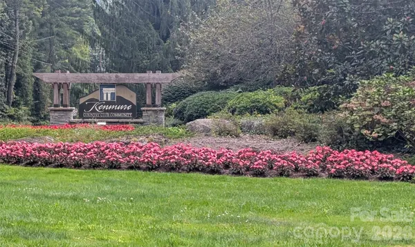 a view of garden with flowers and trees