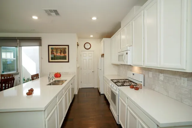 a kitchen with counter top space and cabinets
