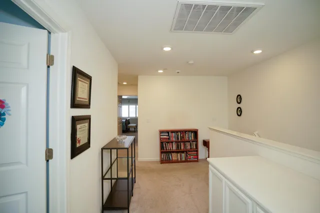 a utility room with fridge dryer and washer