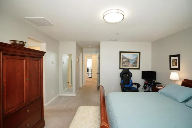 a bedroom with a bed and furniture