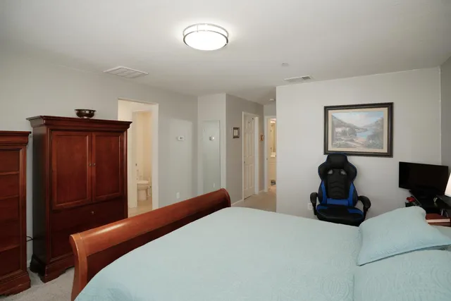 a bathroom with a shower sink and mirror