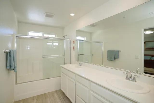 a bathroom with a sink and mirror