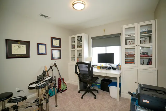 a bedroom with bed and a window