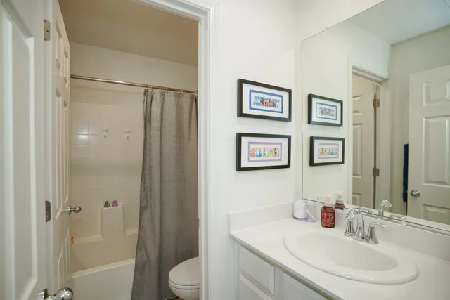 a bathroom with a sink a mirror and shower