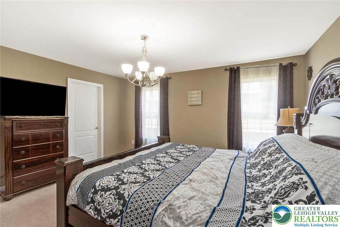 3566 Penfield Way Nazareth, PA 18064 - Photo 40 of 47 A restful primary bedroom retreat features a well-lit interior with ample space.