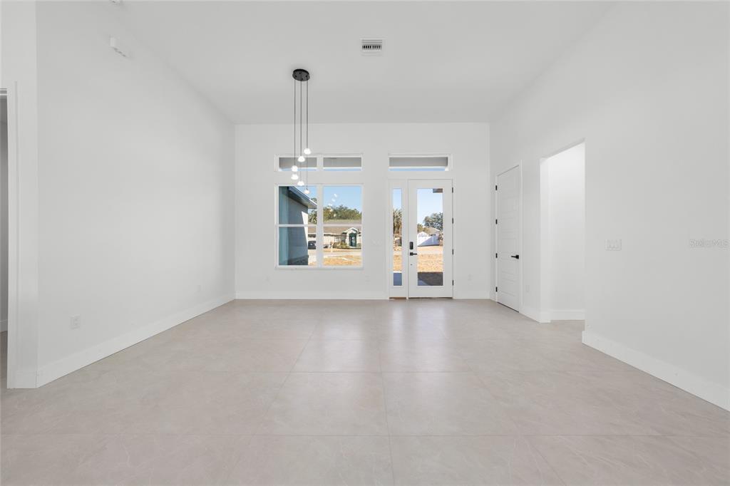 9580 Southwest 44th Avenue Ocala, FL 34476 - Photo 12 of 55 a view of empty room with wooden floor