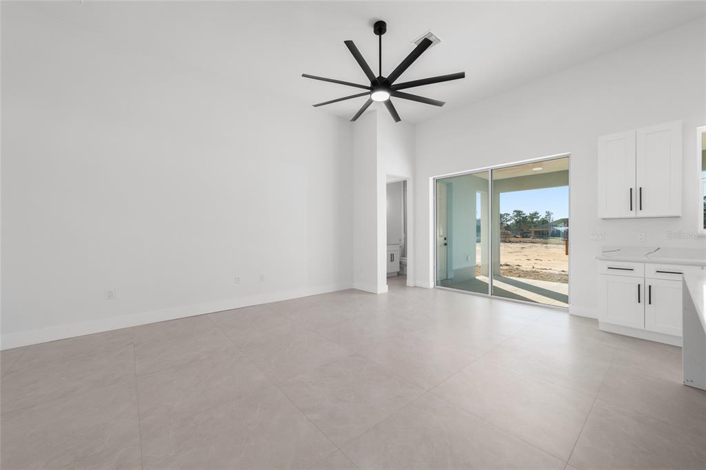 9580 Southwest 44th Avenue Ocala, FL 34476 - Photo 15 of 55 a view of a livingroom with a ceiling fan and window