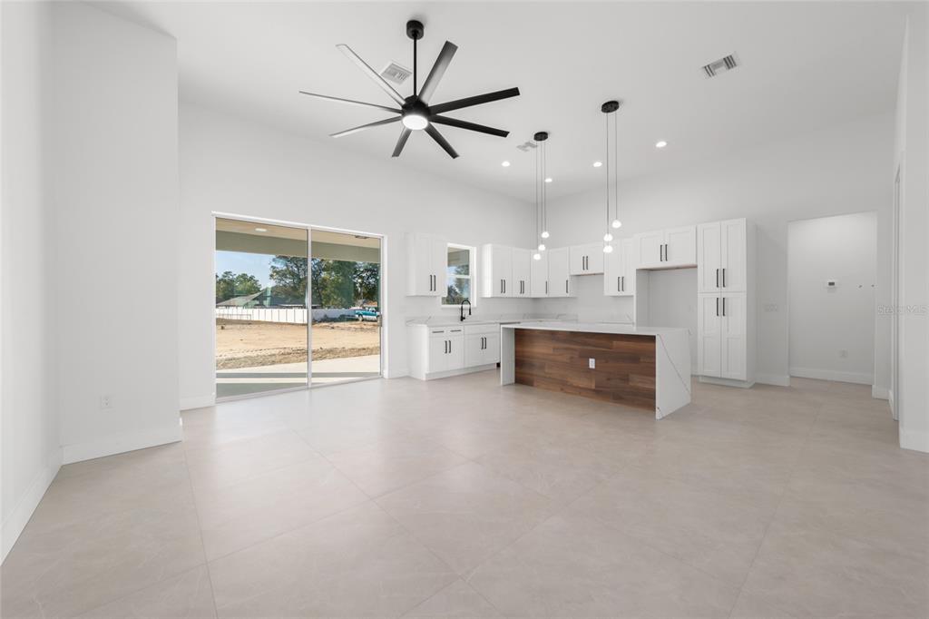 9580 Southwest 44th Avenue Ocala, FL 34476 - Photo 17 of 55 a large white kitchen with a large window appliances and furniture