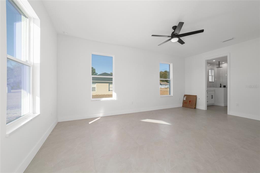 9580 Southwest 44th Avenue Ocala, FL 34476 - Photo 30 of 55 a view of a livingroom with a ceiling fan and window