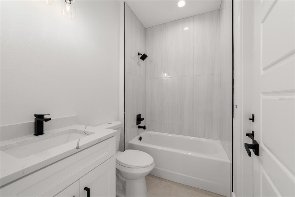 9580 Southwest 44th Avenue Ocala, FL 34476 - Photo 40 of 55 a bathroom with a sink a toilet and shower