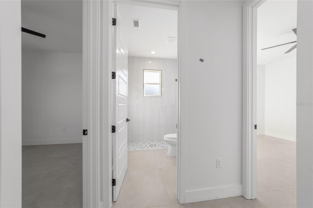 9580 Southwest 44th Avenue Ocala, FL 34476 - Photo 41 of 55 a bathroom with a glass shower door