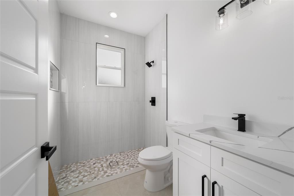 9580 Southwest 44th Avenue Ocala, FL 34476 - Photo 44 of 55 a bathroom with a sink toilet and shower