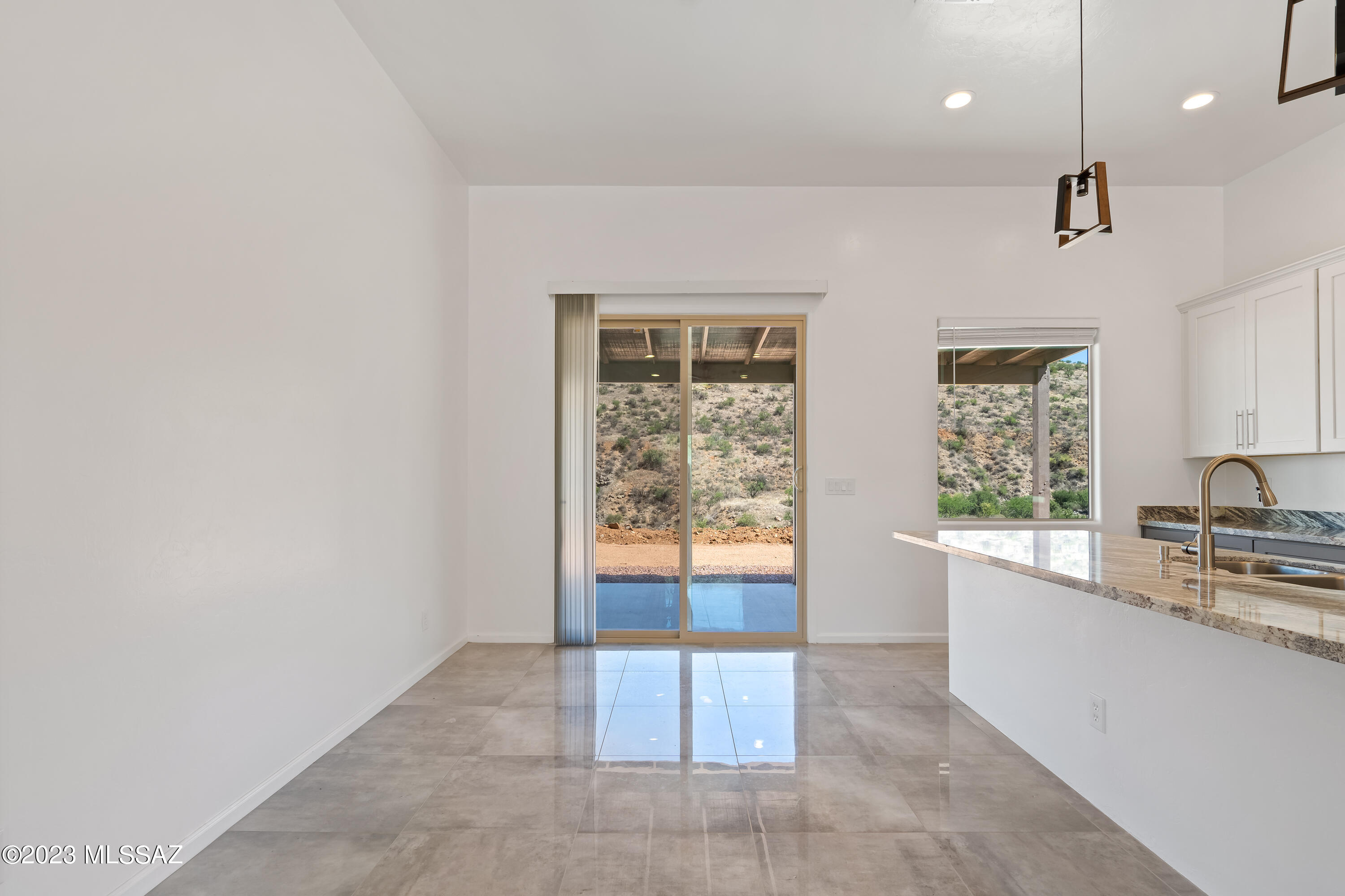 294 Circulo Cerro Rio Rico, AZ 85648 - Photo 15 of 38 a large white kitchen with a large window