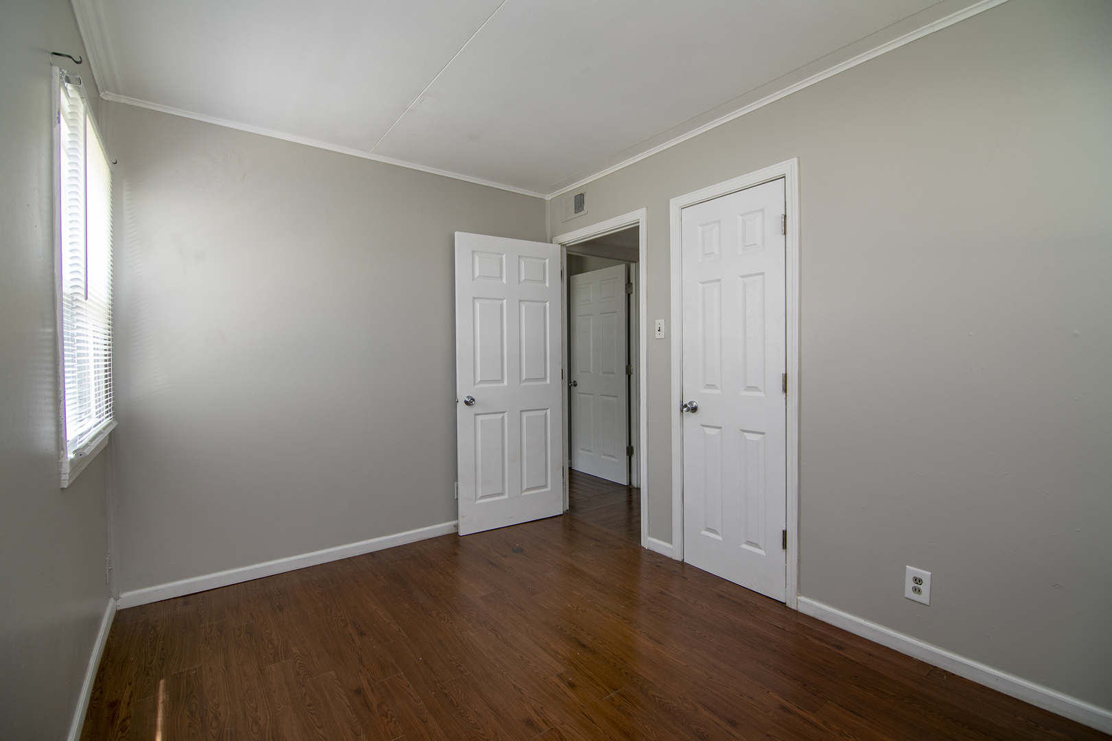 729 Webster Circle West Kankakee, IL 60901 - Photo 9 of 16 a view of an empty room with wooden floor and a window
