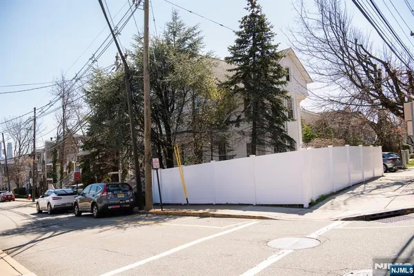 a view of street with parked cars