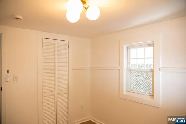 a bathroom with a window and a shower