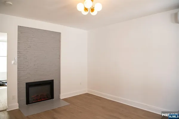 a room with a fireplace and a chandelier