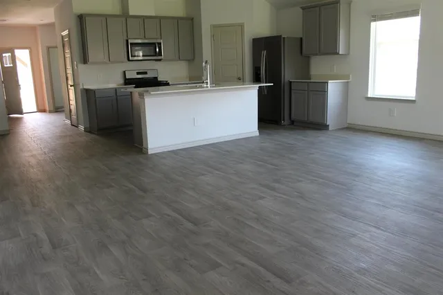 a bathroom with a glass shower door