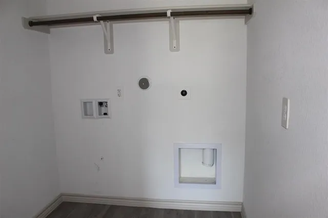 a kitchen with kitchen island a sink stainless steel appliances and cabinets