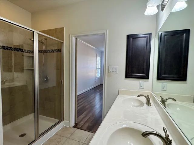 a bathroom with a sink and mirror