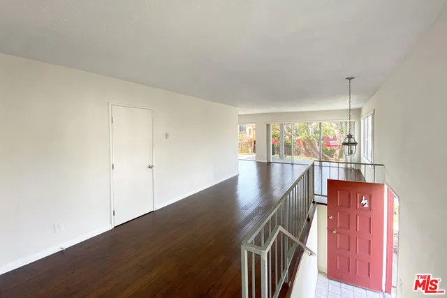 a view of a hallway with a room