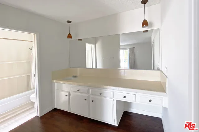 a view of cabinets with wooden floor and cabinet