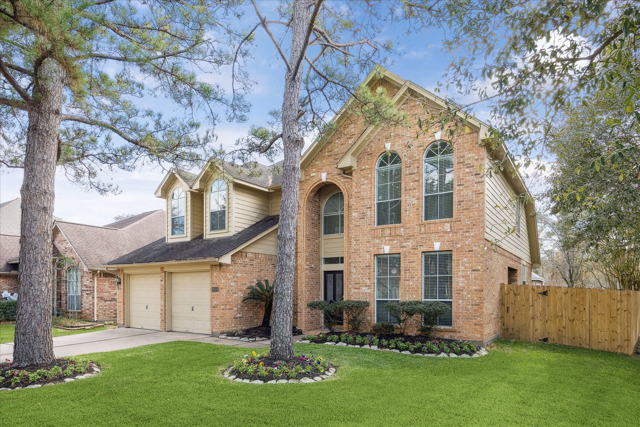 12831 Dove Point Lane Houston, TX 77041 - Photo 2 of 50 a front view of house with a garden