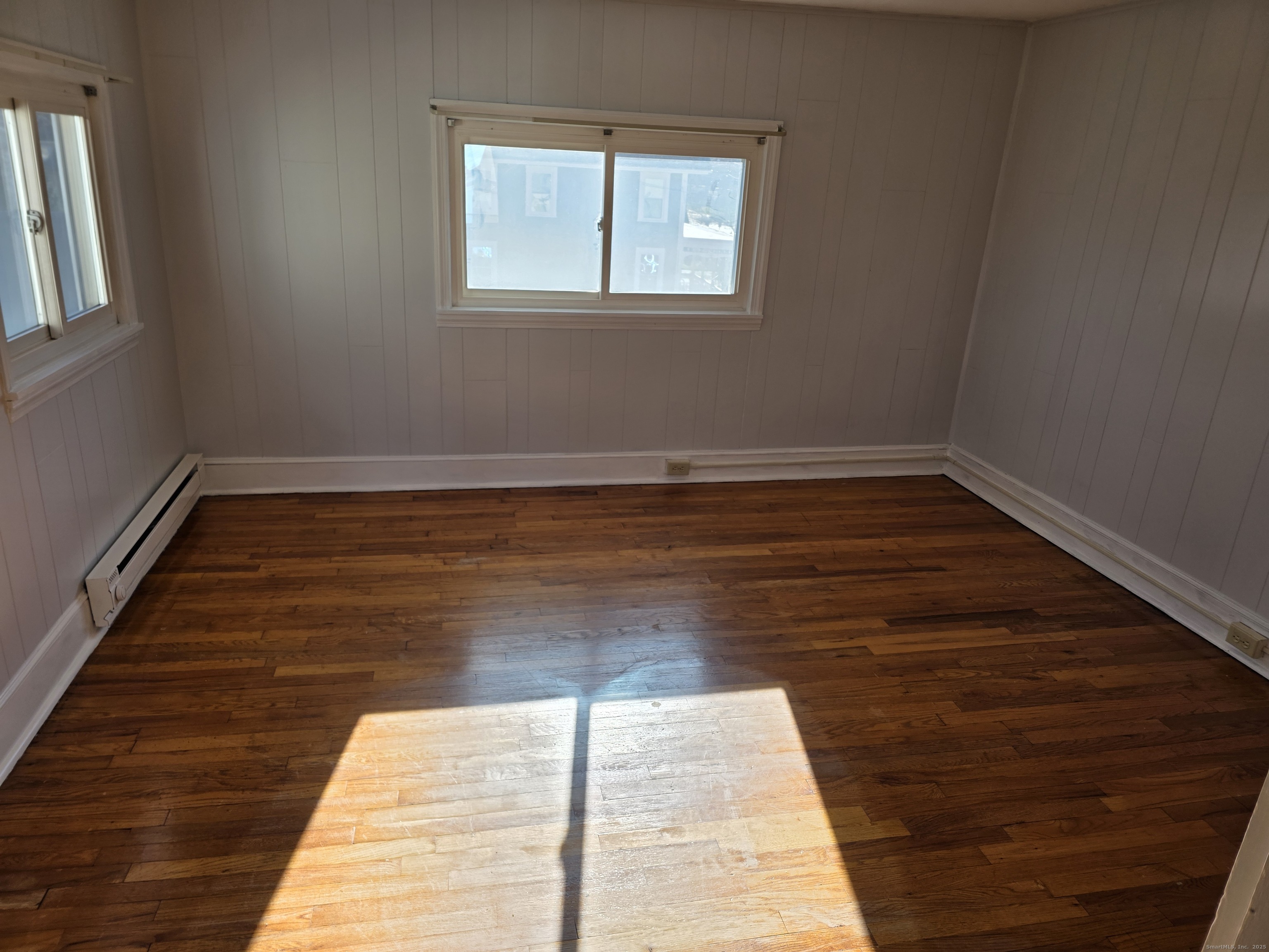 147 Pearl Street Enfield, CT 06082 - Photo 16 of 16 a view of a room with wooden floor and window