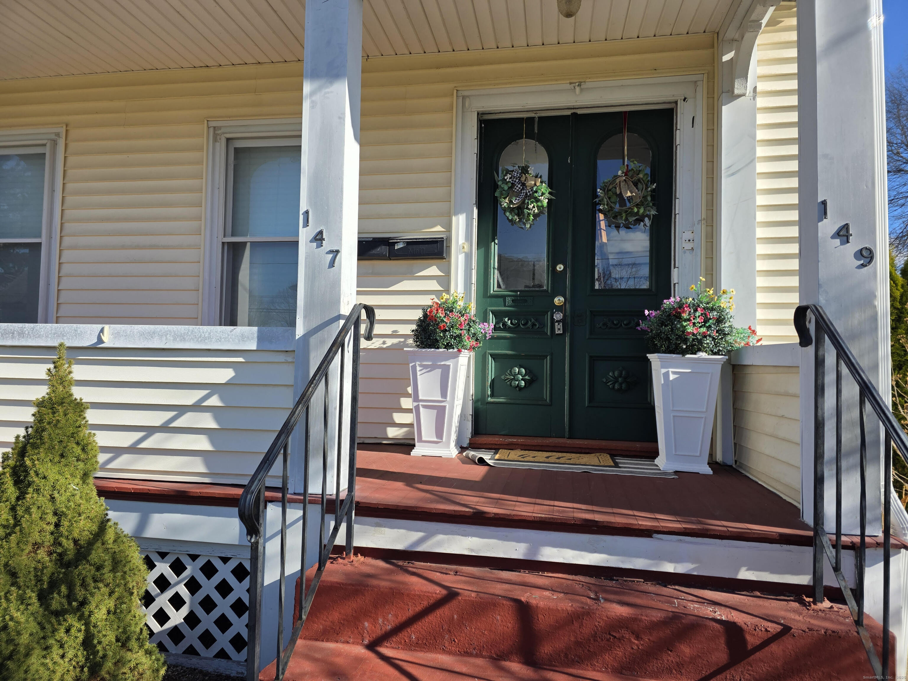 147 Pearl Street Enfield, CT 06082 - Photo 5 of 16 front view of a house with a porch