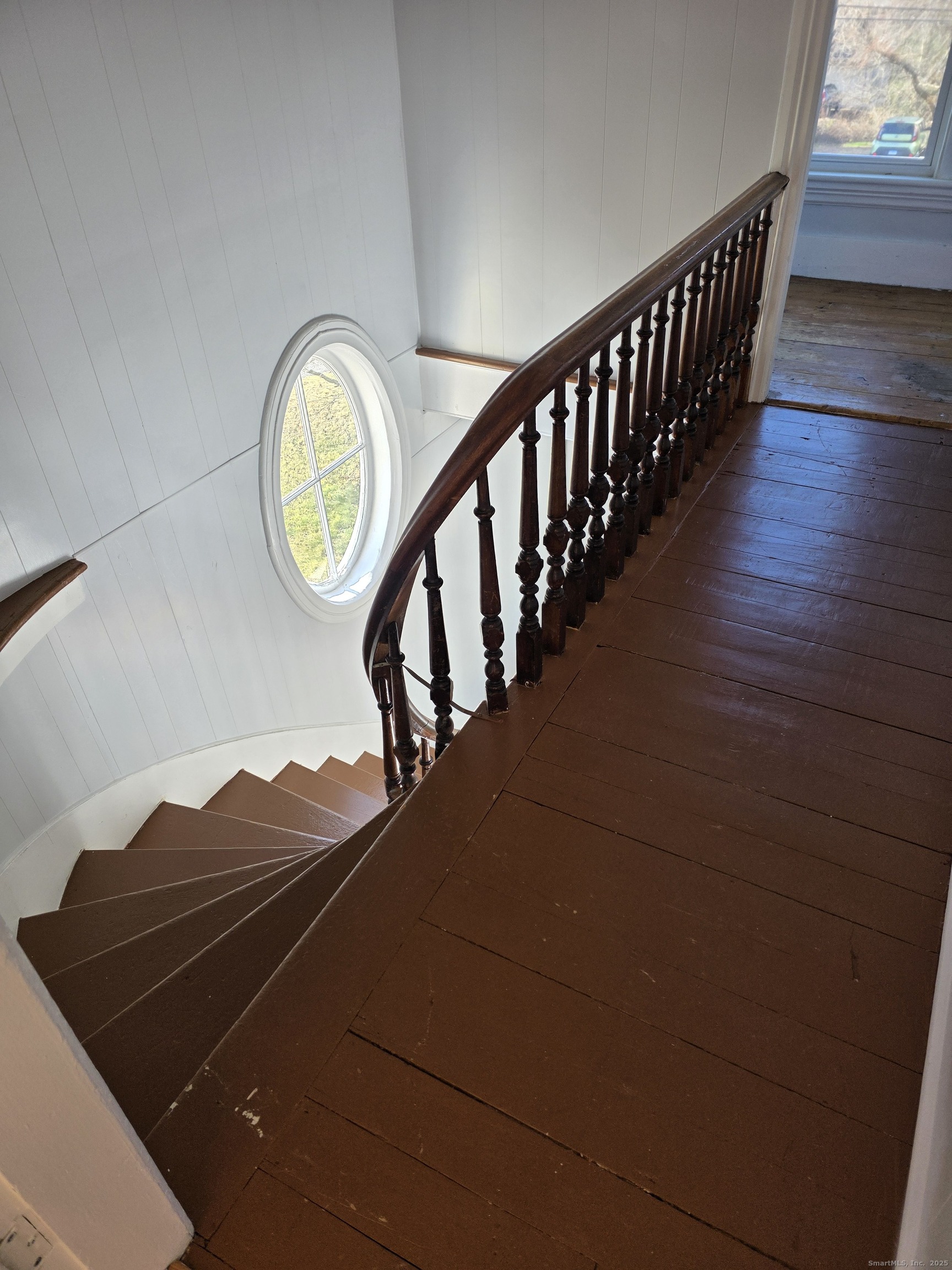 147 Pearl Street Enfield, CT 06082 - Photo 10 of 16 a view of staircase with wooden floor